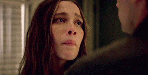 A Close Up Of A Woman Looking At A Man . GIF