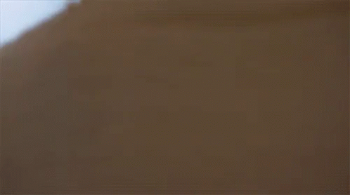 A Close Up Of A Woman Looking At A Man GIF