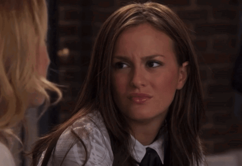 A Close Up Of A Woman Making A Face GIF