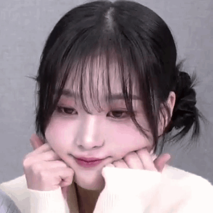 A Close Up Of A Woman Making A Face With Her Hands On Her Face . GIF