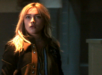 A Close Up Of A Woman Making A Funny Face GIF