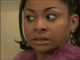 A Close Up Of A Woman Making A Funny Face GIF
