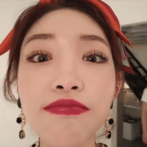 A Close Up Of A Woman Making A Funny Face . GIF