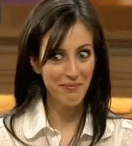 A Close Up Of A Woman Making A Funny Face With Her Eyes Crossed . GIF