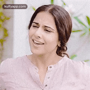 A Close Up Of A Woman Making A Funny Face With Her Mouth Open . GIF