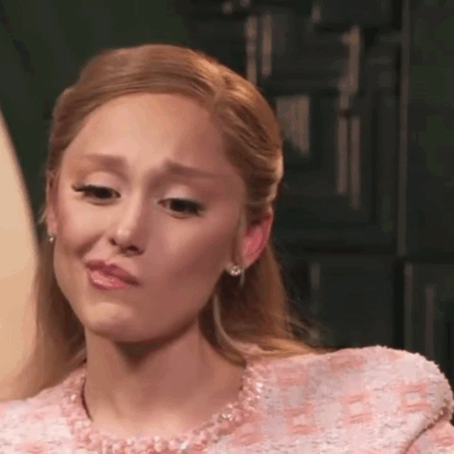 A Close Up Of A Woman Making A Funny Face With Her Mouth Open . GIF