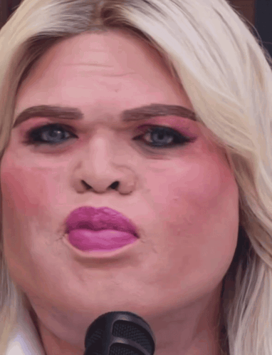 A Close Up Of A Woman Making A Funny Face GIF