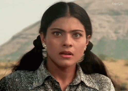 A Close Up Of A Woman Making A Surprised Face . GIF