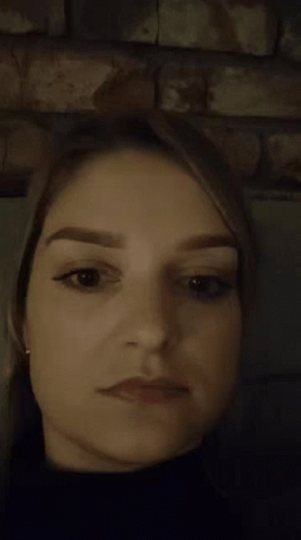 A Close Up Of A Woman Making A Surprised Face GIF