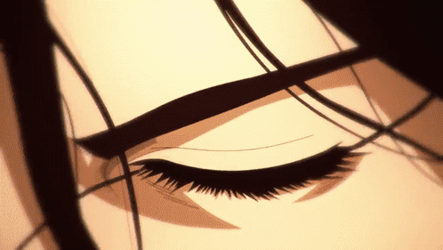 A Close Up Of A Woman 'S Eye With A Black Eye Shadow GIF