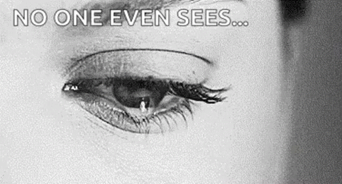 A Close Up Of A Woman 'S Eye With A Tear Coming Out Of It And The Words `` No One Even Sees '' . GIF