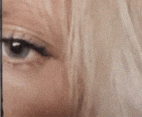 A Close Up Of A Woman 'S Eye With The Words Surprised And Not Surprised GIF