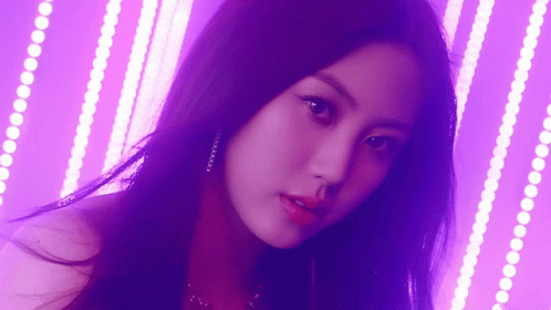 Close Up Of Woman's Face On Purple Background GIF