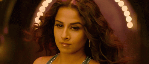 A Close Up Of A Woman 'S Face And Hair GIF
