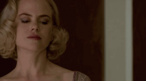 A Close Up Of A Woman 'S Face And Neck GIF