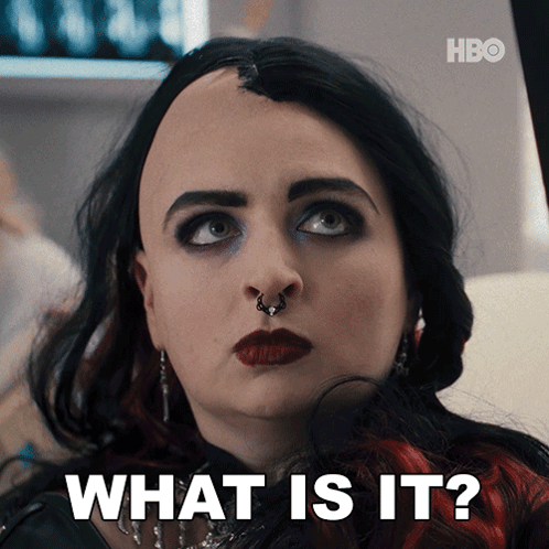 A Close Up Of A Woman 'S Face And The Words What Is It GIF