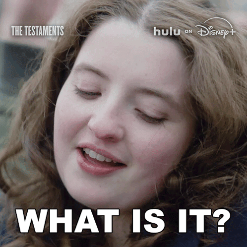 A Close Up Of A Woman 'S Face And The Words What Is It GIF