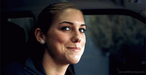 A Close Up Of A Woman 'S Face In A Car . GIF