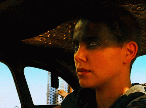 A Close Up Of A Woman 'S Face In A Car With Her Eyes Closed GIF