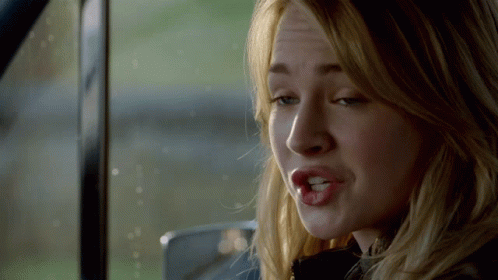Woman's Face Close Up In Car With Open Mouth GIF