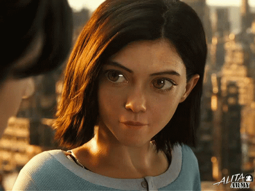A Close Up Of A Woman 'S Face In A Movie Called Alita Story GIF