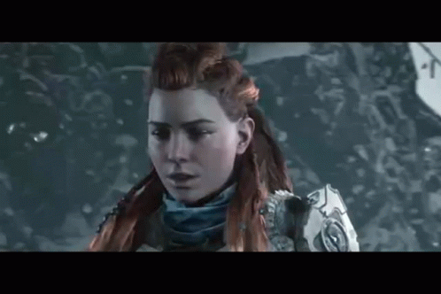 A Close Up Of A Woman 'S Face In A Video Game In The Snow . GIF