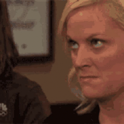 A Close Up Of A Woman 'S Face Looking At Another Woman . GIF