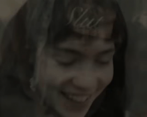 A Close Up Of A Woman 'S Face Smiling GIF