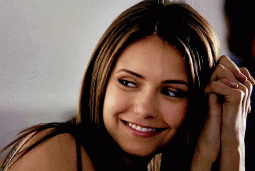 A Close Up Of A Woman 'S Face Smiling GIF