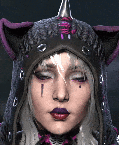 A Close Up Of A Woman 'S Face Wearing A Hooded Cat Hat GIF