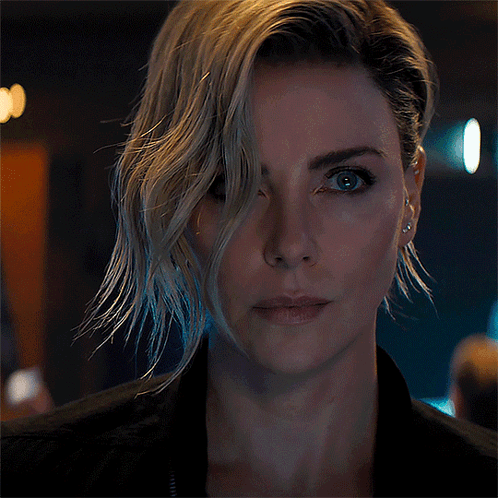 A Close Up Of A Woman 'S Face With A Black Jacket On GIF