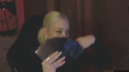 A Close Up Of A Woman 'S Face With A Black Shirt On GIF