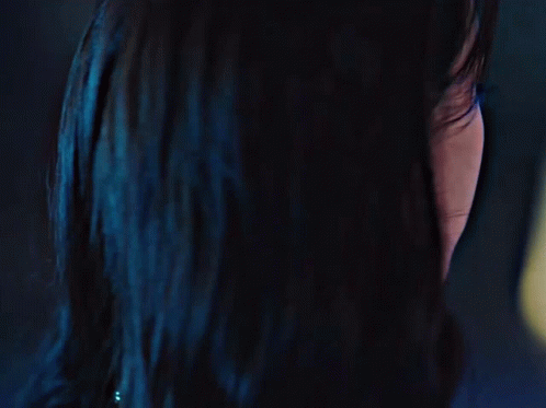 A Close Up Of A Woman 'S Face With A Black Spot On Her Forehead GIF
