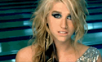 A Close Up Of A Woman 'S Face With A Blue Background GIF