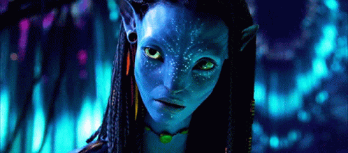 A Close Up Of A Woman 'S Face With A Blue Face Paint GIF