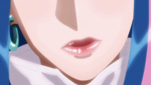 A Close Up Of A Woman 'S Face With A Blue Hair GIF