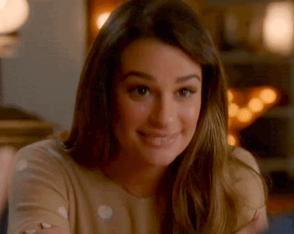 A Close Up Of A Woman 'S Face With A Blurred Background . GIF