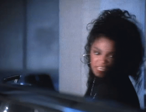 A Close Up Of A Woman 'S Face With A Blurred Background GIF
