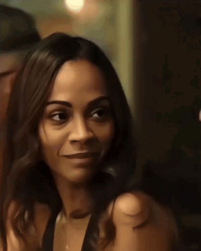 A Close Up Of A Woman 'S Face With A Blurred Background GIF