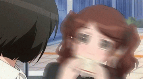 A Close Up Of A Woman 'S Face With A Blurred Background GIF