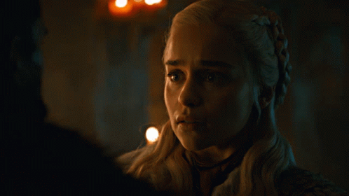 A Close Up Of A Woman 'S Face With A Braided Hair Style GIF