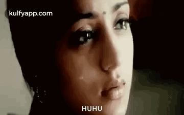 A Close Up Of A Woman 'S Face With A Crying Look On Her Face . GIF