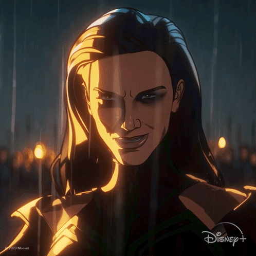 A Close Up Of A Woman 'S Face With A Disney Logo In The Background GIF