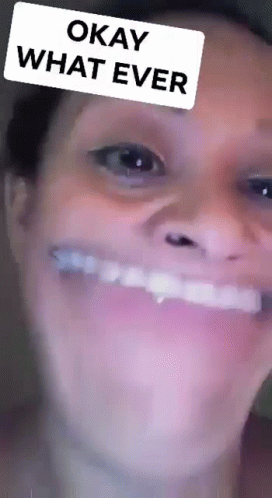 A Close Up Of A Woman 'S Face With A Filter That Says Okay What Ever On It . GIF