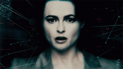 A Close Up Of A Woman 'S Face With A Grid Of Lines Behind Her GIF