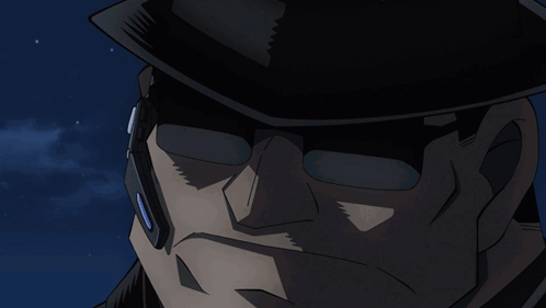 A Close Up Of A Woman 'S Face With A Gun In The Background GIF