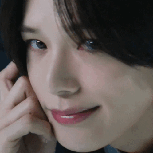 Woman With Hand On Face GIF