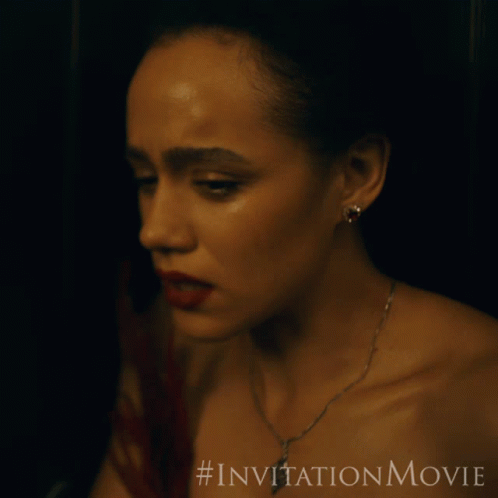 A Close Up Of A Woman 'S Face With A # Invitationmovie Written Below Her GIF