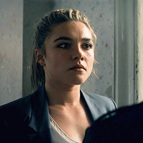 A Close Up Of A Woman 'S Face With A Jacket On GIF