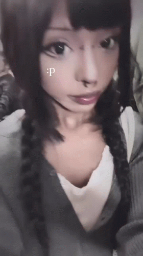 A Close Up Of A Woman 'S Face With A Letter P On Her Face GIF